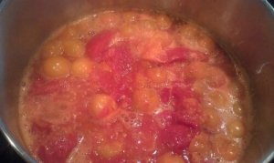 Tomatoes cooking down for sauce